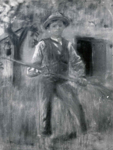 Dječak grablja sijeno